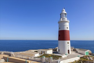 Red and white striped lighthouse at Europa Point, Gibraltar, British territory in southern Spain,