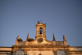 Stork nests, nest, storks nesting on city archway, archway, Arco da Vila, old town, Faro, Algarve,