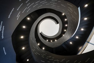 Spiral staircase printed with Finnish words, Oodi Central Library and Cultural Centre, designed by