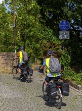 Cyclist in the old town centre, Seligenstadt, Hesse, Germany, Europe