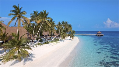 Bird's eye view of sandy beach Maldives beach beach and narrow lagoon of Maldives island with under