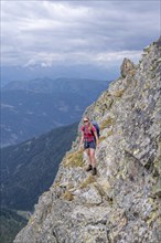 Hiker on the Carnic High Trail, ascent to the Raudenspitze, Carnic Main Ridge, Carnic Alps,