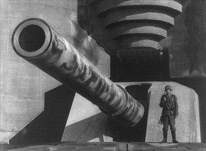 Second World War 1939-1945. barrel of a large cannon with German soldiers at fortifications, 1943.