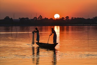 Fishermen fishing in Beki river during sunset, in Barpeta district of Assam, India on 01 Nov. 2019