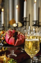 A beautifully arranged table features sparkling champagne flutes and a vibrant array of seasonal