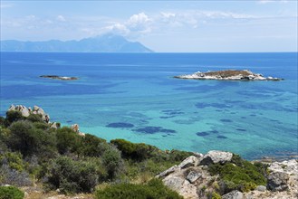 Breathtaking landscape with clear turquoise water and rocky islands in the glow of the sun, view of