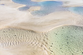 Seawater run-off leaves traces in the sand on Fazayat beach in Al Hauta, Dhofar province, Arabian