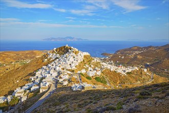 View of Chora village and the port of Livadi and Sifnos island in the distance, Chora, Serifos