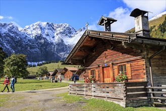 Farmhouse in front of snowy mountains, alpine pasture, autumn, maple trees, sunny, Engalm, Großer