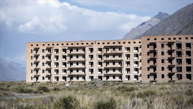 Panorama, Abandoned destroyed buildings in mountain landscape, Soviet apartment blocks, ghost town,