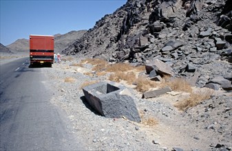 Unfinished, now broken sarcophagus, ancient Egyptian quarry area Wadi Hammamat, Arabian desert,