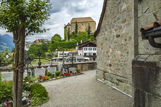 Picturesque cemetery with a view of Scena Castle, on the church hill of Scena above Merano, in the