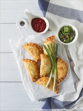 Fried chebureks, close-up, on a light background, no people