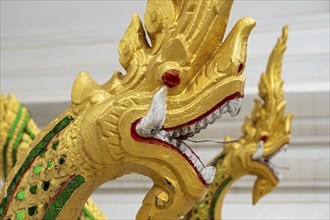 Naga at the steps of Wat Ho Pha Bang temple, Royal Palace, Luang Prabang, Laos, Asia