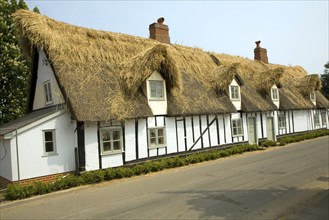 Country cottage being re-thatched, Tattingstone, Suffolk, England, United Kingdom, Europe