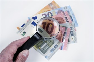 Symbol photo counterfeit money, magnifying glass, check, euro