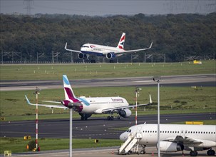 Düsseldorf Airport, British Airways aircraft, Boeing 737, on landing, Eurowings Airbus on the