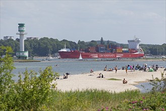 Container ship, sailing boat, lighthouse Friedrichsort, people, beach, Kiel Fjord, Kiel,