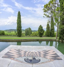 Horizontal sundial and pond in Parco Giardino Sigurtà, Valeggio sul Mincio, Province of Verona,