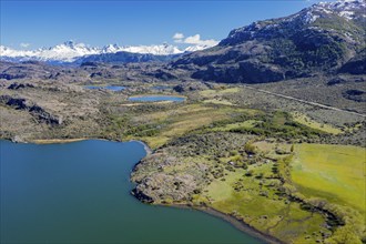 Farm at a lake near Puerto Ingeniero Ibanez, Mt. Cerro Castillo in the back, aerial view,