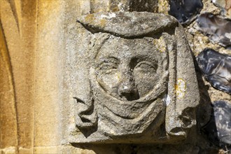 Weathered medieval carved stonework head of a lady or queen, church of Saint Peter, Theberton,