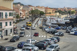 Street and traffic at the harbor in town of Maddalena, the island of La Maddalena, Sardinia, Italy,