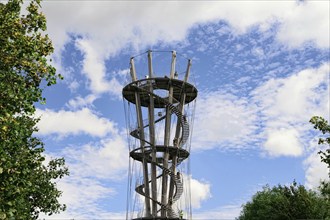 Architectural steel observation tower rises majestically under a blue sky, Schönbuchturm