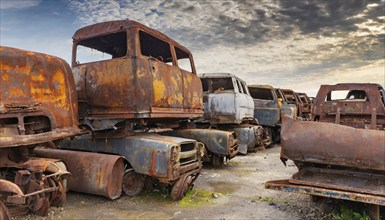 Rusty, abandoned lorries in a junkyard under a cloudy sky, symbol photo, AI generated, AI generated