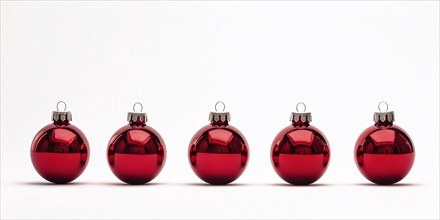 Red Christmas tree bauble ornaments in a row on white background. Generative AI, AI generated