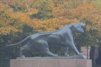 Sculpture Striding Tiger by Philipp Harth 1969, bronze, lion figure, Black panther, orange, autumn