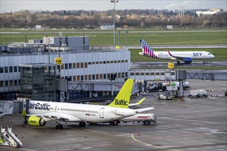 Düsseldorf Airport, Sky Express aircraft on the taxiway for take-off, Air Baltic aircraft at