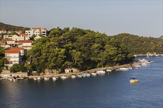 High angle view of tan and white trim houses and villas with traditional terracotta clay tile