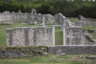 High angle view of old stone wall structure with entrance gate at ancient 3rd century Roman ruins