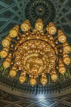 Dome and illuminated chandelier in the Sultan Qaboos Mosque, Muscat, Arabian Peninsula, Sultanate