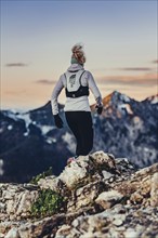 Trail running in autumn on the Jochberg on Lake Walchensee against the wonderful backdrop of the