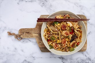 Fried noodles with chicken meat and vegetables, Bami Goreng, Indonesian dish, no people