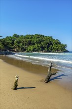 Paradisiacal Castelhanos beach surrounded by hills and forests on the island of Ilhabela Ilhabela,