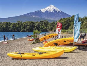 Beach in village Ensenada, lake Lago Llanquihue, view towards snowcovered volcano Osorno,