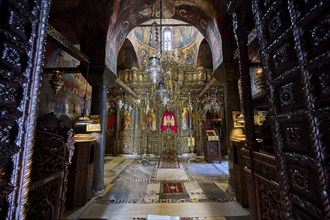 Interior view of a magnificent Orthodox church with icons, altarpieces and elaborate decoration,