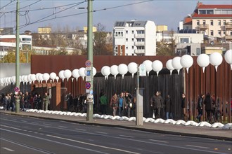 To mark the 25th anniversary of the fall of the Berlin Wall, illuminated balloons symbolise the