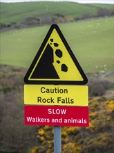 Single track road at St. Abbs head, warning sign to be aware of walkers and rock fall, uk, United