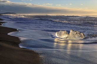 Ice floes on the beach, waves, sunny, morning mood, winter, Diamond Beach, Breidamerkursandur,