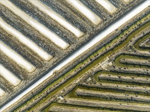 Saline ponds at the salt works near Chiclana de la Frontera. Aerial view. Drone shot. Cádiz