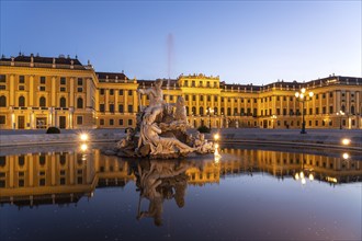 Fountain in the courtyard of honour at Schönbrunn Palace at dusk, UNESCO World Heritage Site in