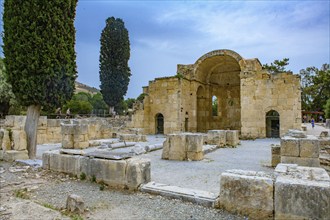 View of ancient ruins of Titus Basilica, in the foreground remains of stones foundation walls of