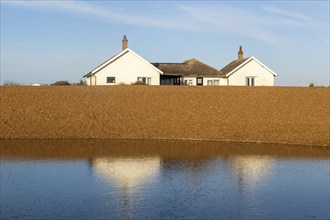 The Beacons bungalow house on beach at Shingle Street, Hollesley Bay, Suffolk, England, UK