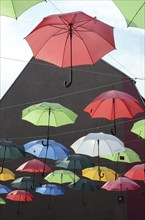 Many umbrellas hang over the street in Vejle, Jutland, Denmark, Scandinavia, Europe