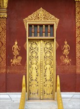 Ornate door at Wat Sensoukaram, Luang Prabang, Laos, Asia