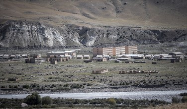 Abandoned ruined buildings in a mountain landscape, ghost town, Engilchek, Tian Shan, Kyrgyzstan,