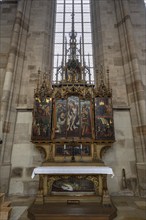 Sebastian altar, dated 1520-1530, in the late Gothic hall church of St George, Dinkelsbühl,